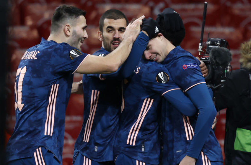 Arsenal's English midfielder Emile Smith Rowe (R) celebrates with teammates after scoring their fourth goal during the UEFA Europa League 1st Round Group B football match between Arsenal and Rapid Vienna at the Emirates Stadium in London on December 3, 2020. (Photo by Adrian DENNIS / AFP) (Photo by ADRIAN DENNIS/AFP via Getty Images)