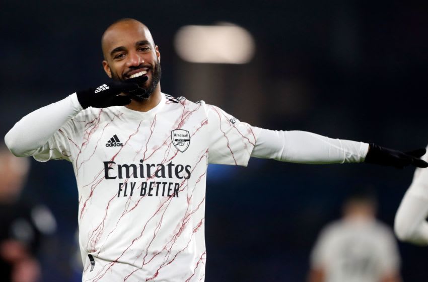 Arsenal's French striker Alexandre Lacazette celebrates scoring his team's first goal during the English Premier League football match between Brighton and Hove Albion and Arsenal at the American Express Community Stadium in Brighton, southern England on December 29, 2020. (Photo by Frank Augstein / POOL / AFP) / RESTRICTED TO EDITORIAL USE. No use with unauthorized audio, video, data, fixture lists, club/league logos or 'live' services. Online in-match use limited to 120 images. An additional 40 images may be used in extra time. No video emulation. Social media in-match use limited to 120 images. An additional 40 images may be used in extra time. No use in betting publications, games or single club/league/player publications. / (Photo by FRANK AUGSTEIN/POOL/AFP via Getty Images)