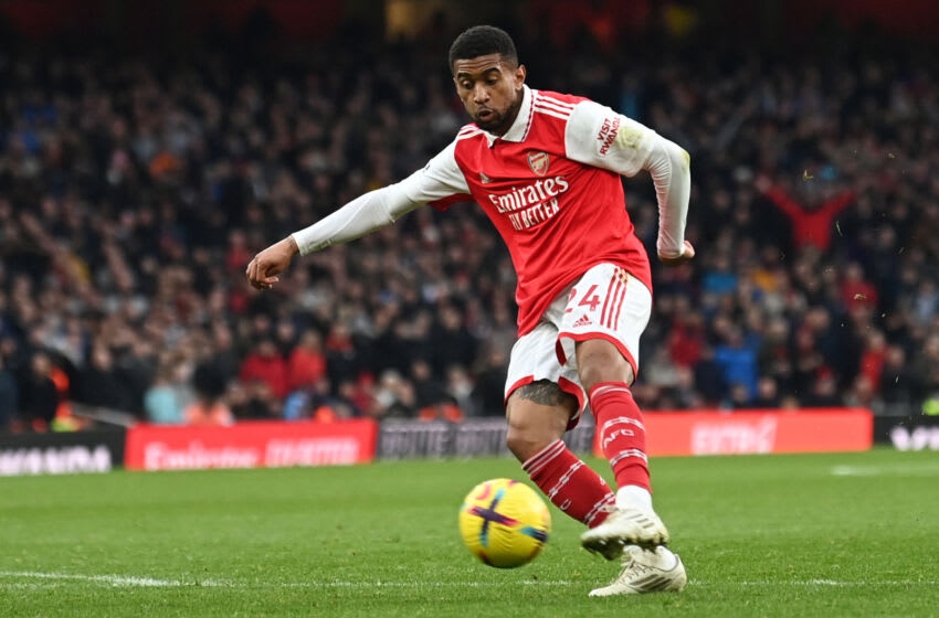 TOPSHOT - Arsenal's English midfielder Reiss Nelson shoots and scores the third goal of the team during the English Premier League football match between Arsenal and Bournemouth at the Emirates Stadium in London on March 4, 2023. (Photo by Glyn KIRK / AFP) / RESTRICTED TO EDITORIAL USE. No use with unauthorized audio, video, data, fixture lists, club/league logos or 'live' services. Online in-match use limited to 120 images. An additional 40 images may be used in extra time. No video emulation. Social media in-match use limited to 120 images. An additional 40 images may be used in extra time. No use in betting publications, games or single club/league/player publications. / (Photo by GLYN KIRK/AFP via Getty Images)