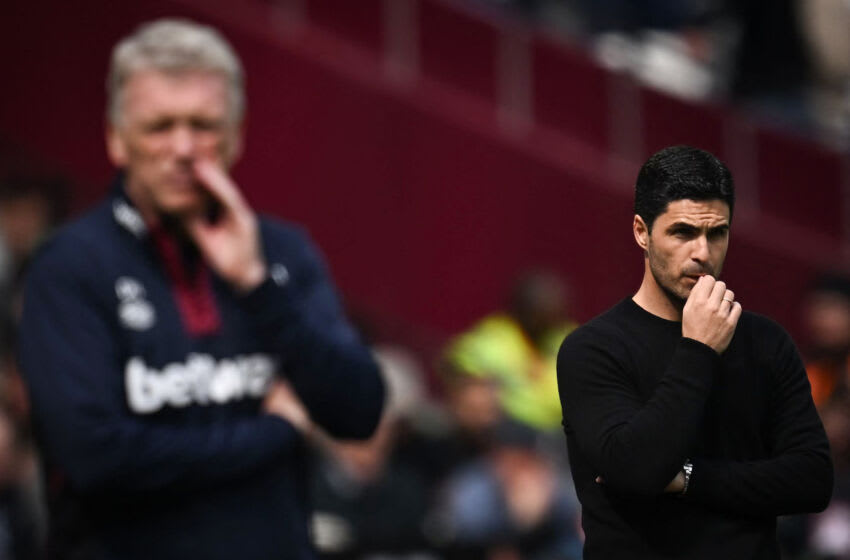 Arsenal's Spanish manager Mikel Arteta (R) reacts next to West Ham United's Scottish manager David Moyes during the English Premier League football match between West Ham United and Arsenal at the London Stadium, in London on April 16, 2023. (Photo by Ben Stansall / AFP) / RESTRICTED TO EDITORIAL USE. No use with unauthorized audio, video, data, fixture lists, club/league logos or 'live' services. Online in-match use limited to 120 images. An additional 40 images may be used in extra time. No video emulation. Social media in-match use limited to 120 images. An additional 40 images may be used in extra time. No use in betting publications, games or single club/league/player publications. / (Photo by BEN STANSALL/AFP via Getty Images)