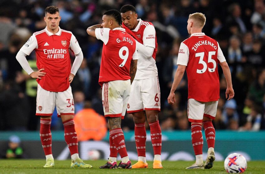 Arsenal players react after conceding a third goal during the English Premier League football match between Manchester City and Arsenal at the Etihad Stadium in Manchester, north west England, on April 26, 2023. (Photo by Oli SCARFF / AFP) / RESTRICTED TO EDITORIAL USE. No use with unauthorized audio, video, data, fixture lists, club/league logos or 'live' services. Online in-match use limited to 120 images. An additional 40 images may be used in extra time. No video emulation. Social media in-match use limited to 120 images. An additional 40 images may be used in extra time. No use in betting publications, games or single club/league/player publications. / (Photo by OLI SCARFF/AFP via Getty Images)