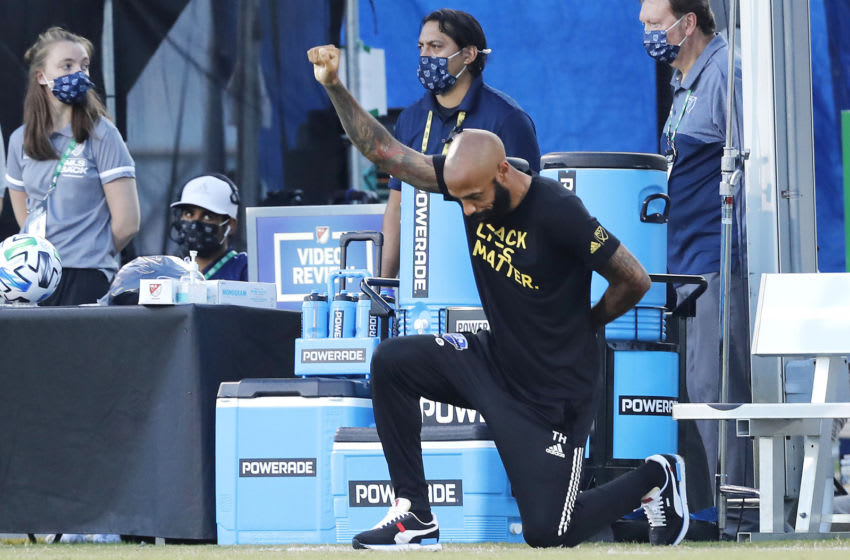 REUNION, FLORIDA - JULY 16: Head coach Thierry Henry of Montreal Impact takes a knee in support of the Black Lives Matter movement prior to a Group C match against Toronto FC as part of the MLS Is Back Tournament at ESPN Wide World of Sports Complex on July 16, 2020 in Reunion, Florida. (Photo by Michael Reaves/Getty Images)