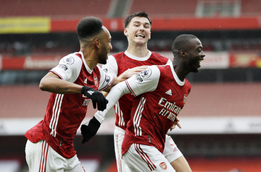 LONDON, ENGLAND - OCTOBER 04: Nicolas Pepe of Arsenal celebrates with teammates after scoring his team's second goal during the Premier League match between Arsenal and Sheffield United at Emirates Stadium on October 04, 2020 in London, England. Sporting stadiums around the UK remain under strict restrictions due to the Coronavirus Pandemic as Government social distancing laws prohibit fans inside venues resulting in games being played behind closed doors. (Photo by Kirsty Wigglesworth - Pool/Getty Images)