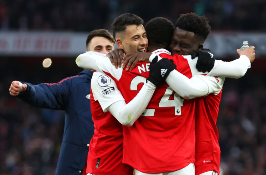 LONDON, ENGLAND - MARCH 04: Reiss Nelson of Arsenal (obscured) celebrates victory with teammates Gabriel Martinelli and Bukayo Saka following the Premier League match between Arsenal FC and AFC Bournemouth at Emirates Stadium on March 04, 2023 in London, England. (Photo by Julian Finney/Getty Images)