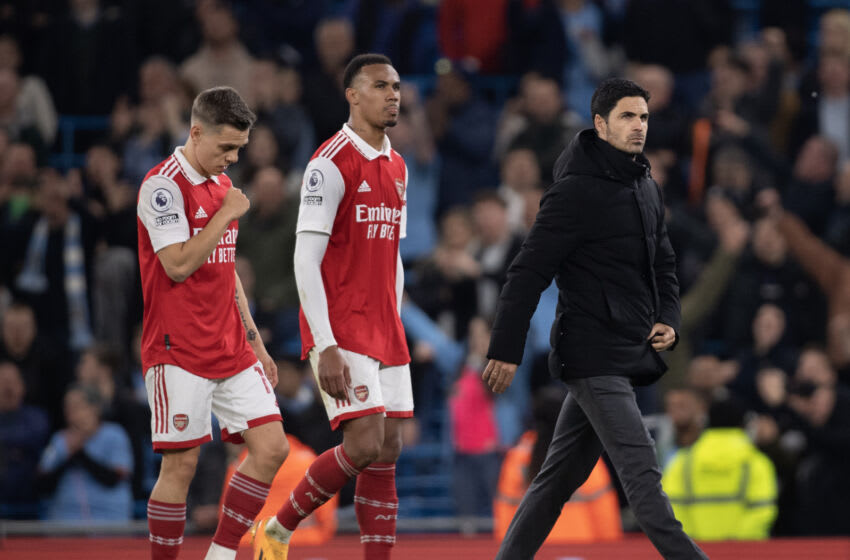 MANCHESTER, ENGLAND - APRIL 26: Arsenal manager Mikel Arteta walks off the pitch looking dejected followed by Leandro Trossard and Gabriel Magalhaes of Arsenal following the Premier League match between Manchester City and Arsenal FC at Etihad Stadium on April 26, 2023 in Manchester, United Kingdom. (Photo by Joe Prior/Visionhaus via Getty Images)
