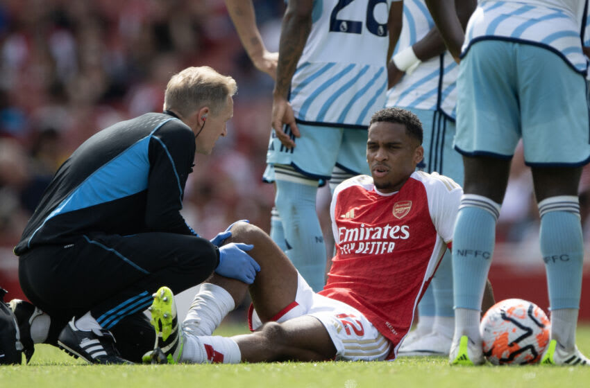LONDON, ENGLAND - AUGUST 12: Jurrien Timber of Arsenal receives treatment from Arsenal medical staff during the Premier League match between Arsenal FC and Nottingham Forest at Emirates Stadium on August 12, 2023 in London, England. (Photo by Visionhaus/Getty Images)