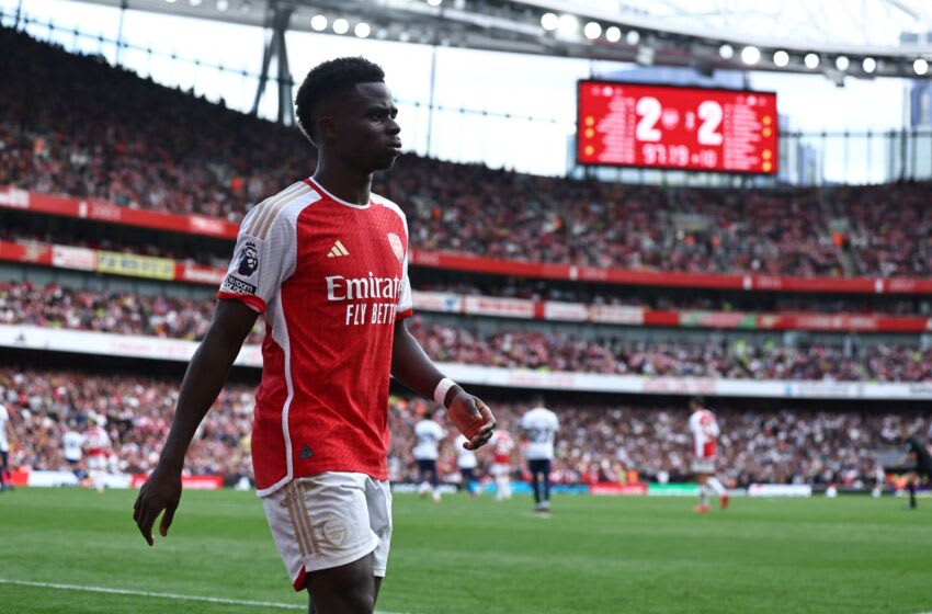 Arsenal's English midfielder #07 Bukayo Saka walks around the pitch having been substituted during the English Premier League football match between Arsenal and Tottenham Hotspur at the Emirates Stadium in London on September 24, 2023. (Photo by HENRY NICHOLLS / AFP) / RESTRICTED TO EDITORIAL USE. No use with unauthorized audio, video, data, fixture lists, club/league logos or 'live' services. Online in-match use limited to 120 images. An additional 40 images may be used in extra time. No video emulation. Social media in-match use limited to 120 images. An additional 40 images may be used in extra time. No use in betting publications, games or single club/league/player publications. / (Photo by HENRY NICHOLLS/AFP via Getty Images)