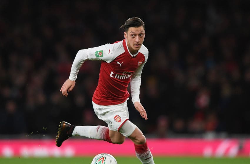 LONDON, ENGLAND - JANUARY 24: Mesut Ozil of Arsenal runs with the ball during Carabao Cup Semi-Final Second Leg match between Arsenal and Chelsea the at Emirates Stadium on January 24, 2018 in London, England. (Photo by Shaun Botterill/Getty Images)